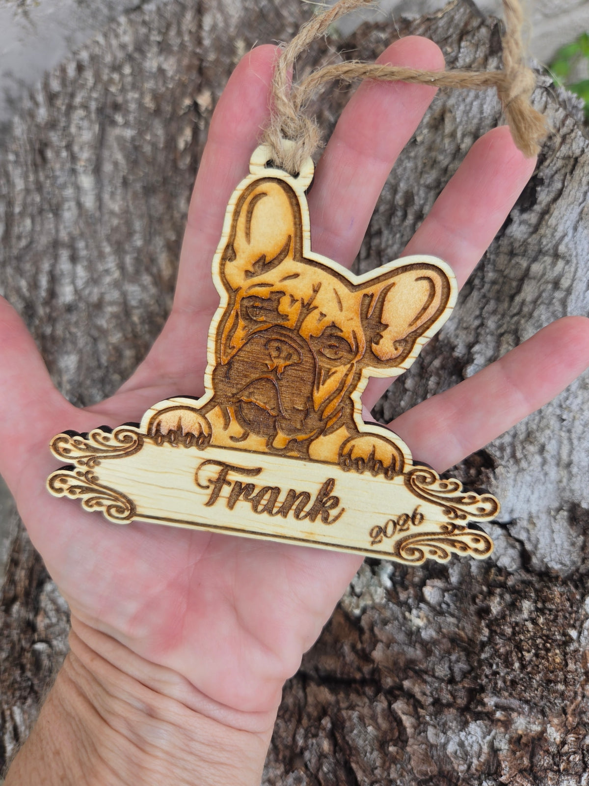 French Bulldog plaque ornament held in an open hand to show its size
