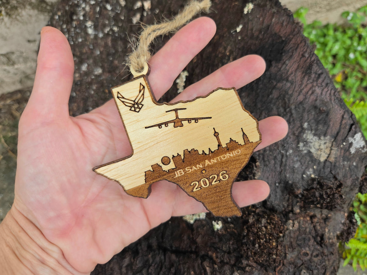 JB San Antonio Texas ornament held in an open hand to show its size