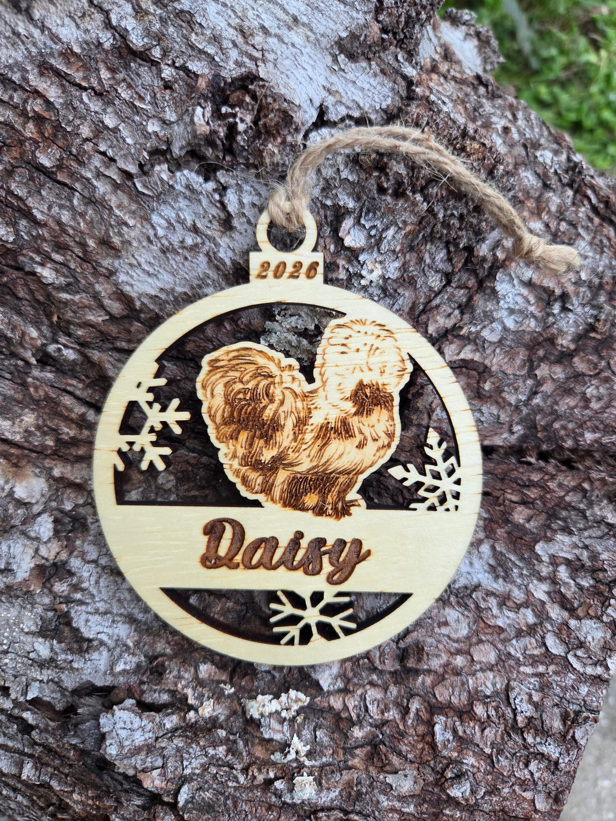 Wooden Silkie chicken and snowflakes ornament, front with a sample name and year engraved, without its colored back