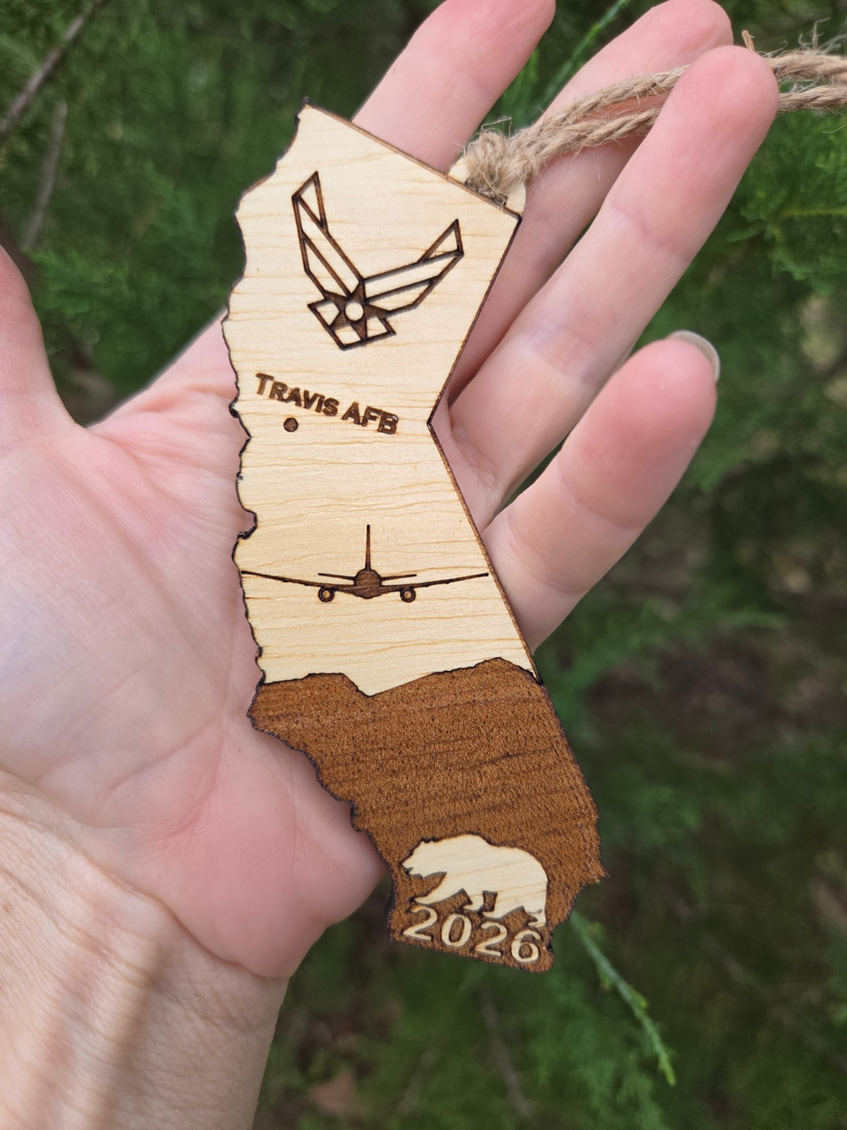 Travis AFB KC-46A California ornament held in an open hand to show its size